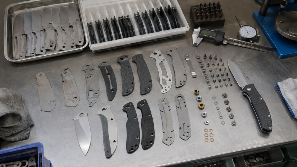 Realistic professional product photography of a complete folding knife production process,