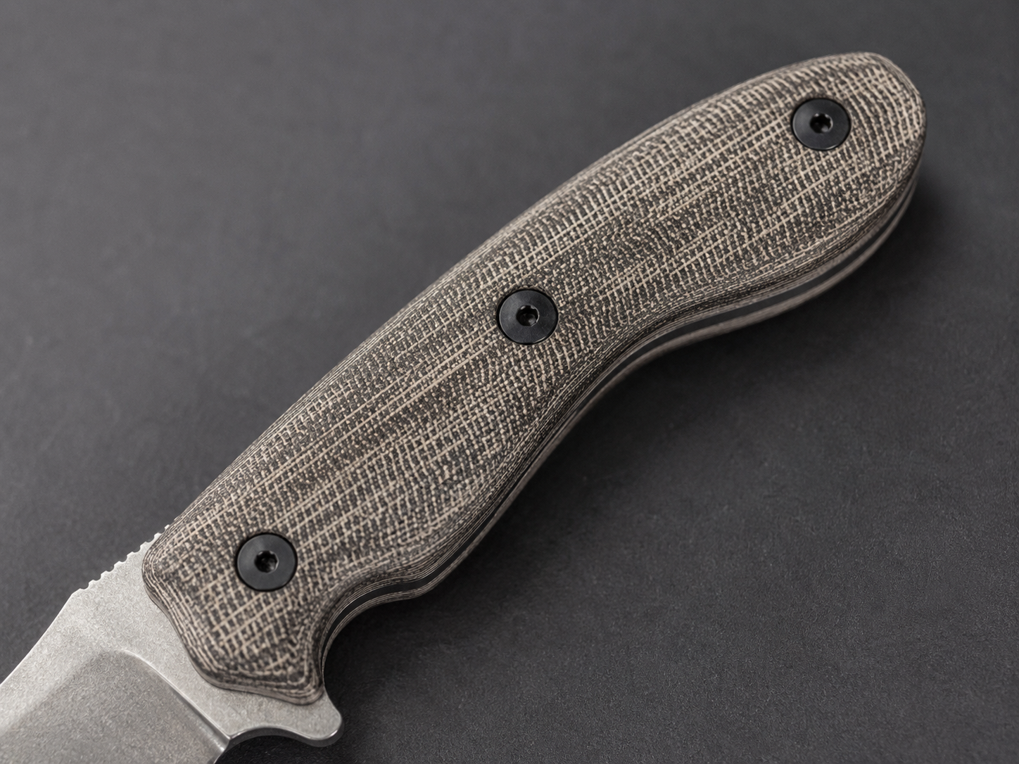Close-up display of Micarta knife handle material