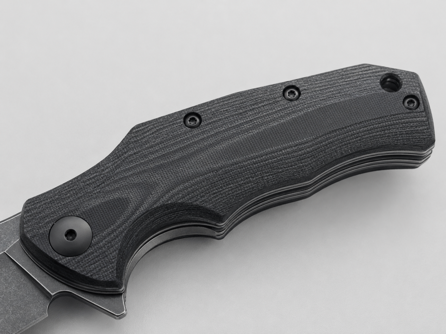 Close-up display of G10 knife handle material texture